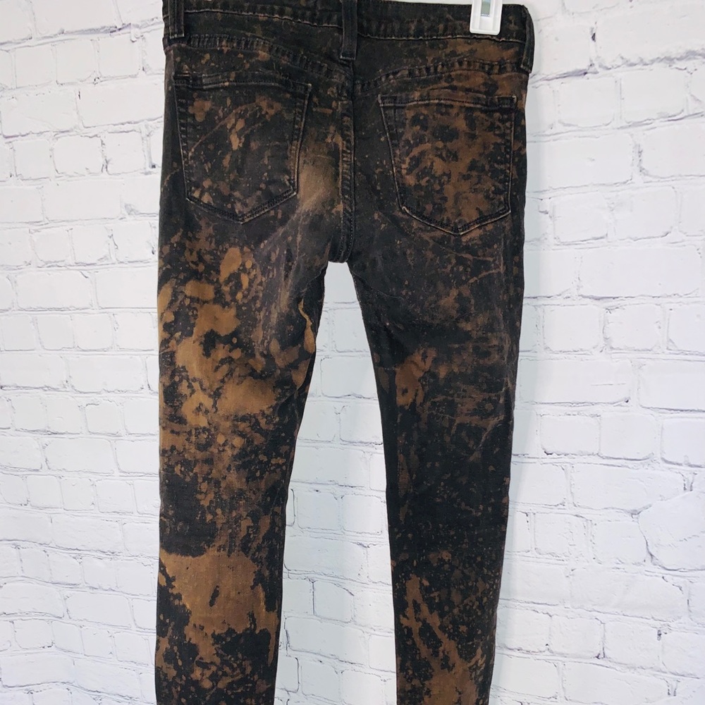 Black bleach dyed skinny ripped jeans